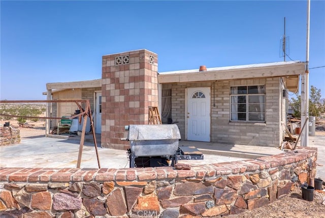 72082 Winters Rd Unit 29, Palms, CA 92277 - rear view of house with a patio
