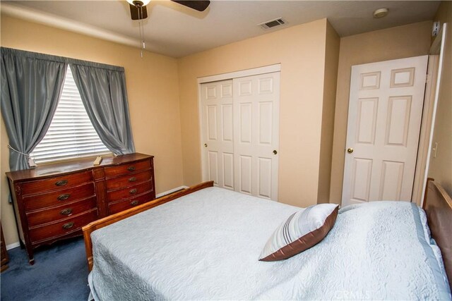 21295 Wisteria St, Apple Valley, CA 92308 - bedroom with dark colored carpet, a closet, and ceiling fan