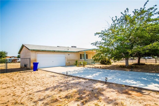 21295 Wisteria St, Apple Valley, CA 92308 - single story home featuring concrete driveway and an attached garage