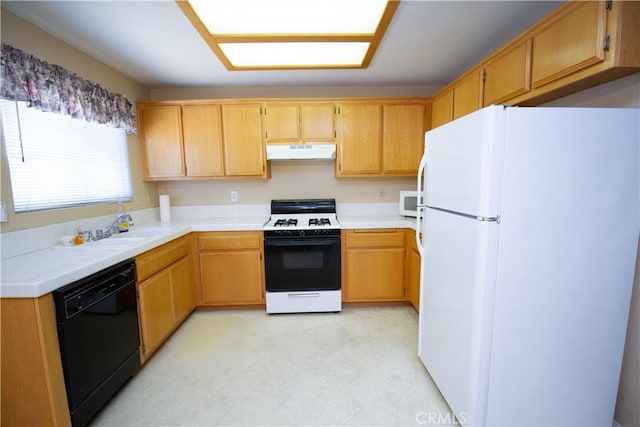 21295 Wisteria St, Apple Valley, CA 92308 - kitchen with white appliances, under cabinet range hood, tile countertops, and light floors