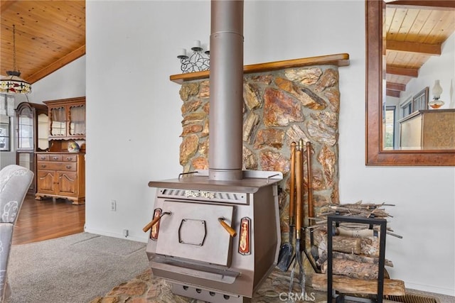 501 Old State Rd, Wofford Heights, CA 93285 - detailed view of a wood ceiling with exposed beams, a wood stove, and carpet flooring