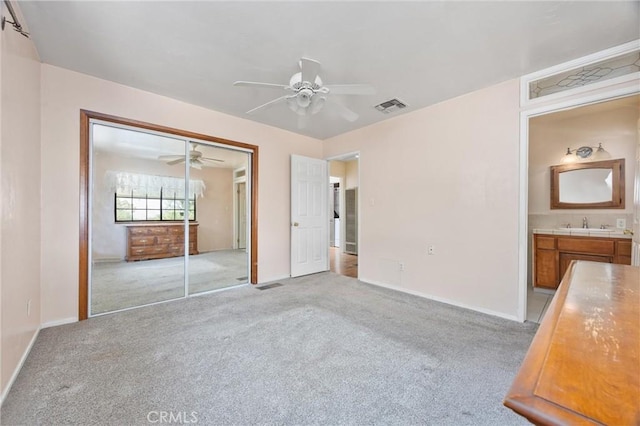 501 Old State Rd, Wofford Heights, CA 93285 - unfurnished bedroom featuring light colored carpet, ceiling fan, a closet, and ensuite bath