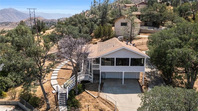 501 Old State Rd, Wofford Heights, CA 93285 - view of front of home featuring a sunroom, stairs, driveway, a mountain view, and an attached garage