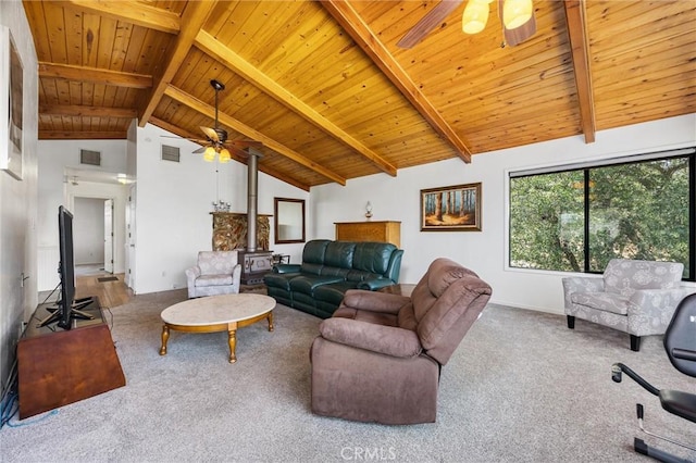 501 Old State Rd, Wofford Heights, CA 93285 - living area featuring ceiling fan, a wood stove, carpet flooring, a wood ceiling with exposed beams, and high vaulted ceiling