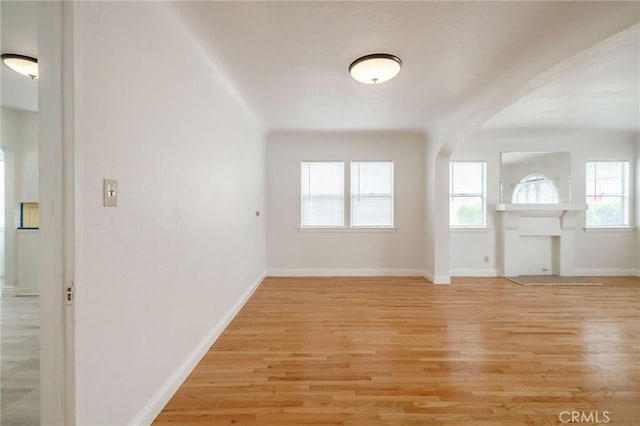 473 W 17th St, San Pedro, CA 90731 - entrance foyer with plenty of natural light, arched walkways, and light wood-type flooring