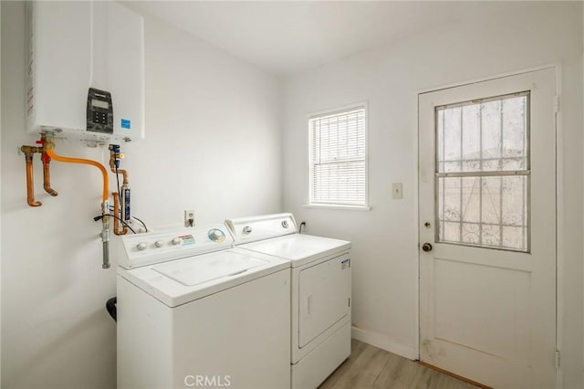 473 W 17th St, San Pedro, CA 90731 - laundry area with water heater, separate washer and dryer, and light wood-style floors