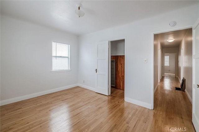 473 W 17th St, San Pedro, CA 90731 - unfurnished bedroom featuring light wood-style floors and a spacious closet