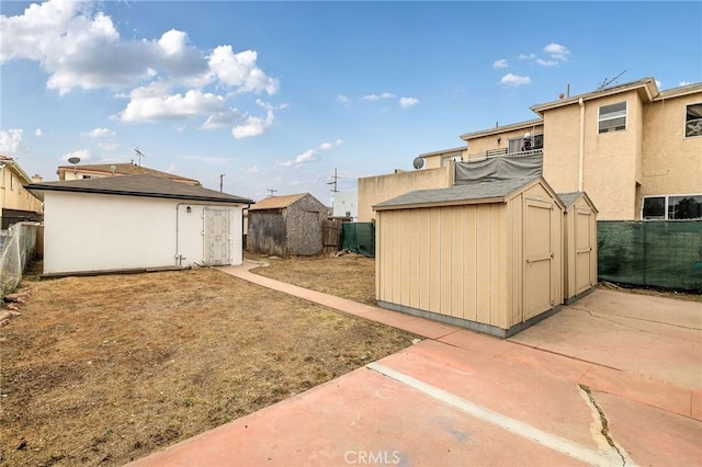 473 W 17th St, San Pedro, CA 90731 - fenced backyard with a storage shed and a patio area