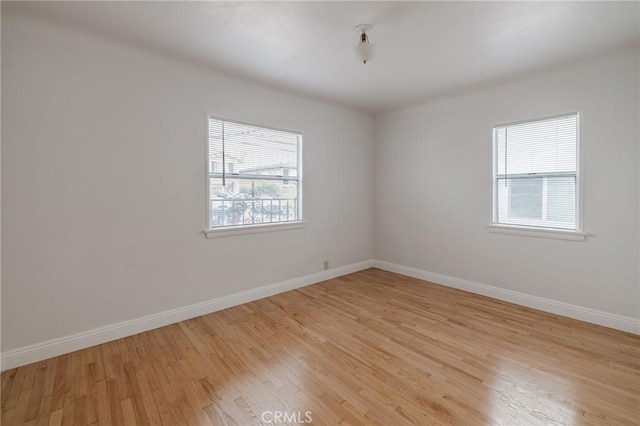 473 W 17th St, San Pedro, CA 90731 - empty room featuring light wood-type flooring and baseboards