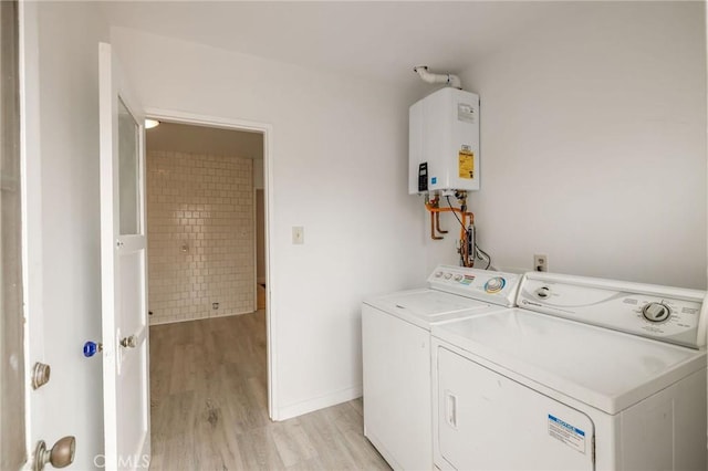 473 W 17th St, San Pedro, CA 90731 - laundry room featuring tankless water heater, washing machine and dryer, and light wood-style flooring
