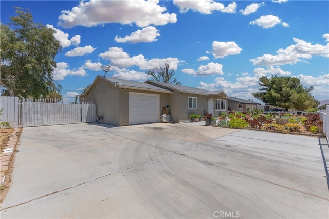 16116 Cajon, Hesperia, CA 92345 - single story home featuring concrete driveway, an attached garage, stucco siding, and a gate