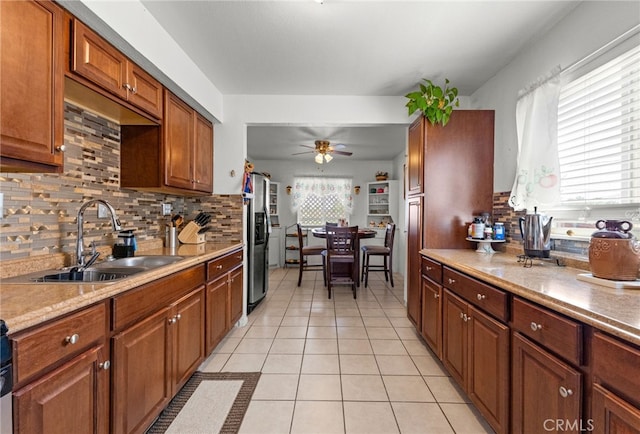 16116 Cajon, Hesperia, CA 92345 - kitchen featuring backsplash, a ceiling fan, light tile patterned floors, light countertops, and stainless steel fridge with ice dispenser