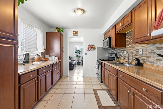 16116 Cajon, Hesperia, CA 92345 - kitchen with appliances with stainless steel finishes, decorative backsplash, and light tile patterned flooring