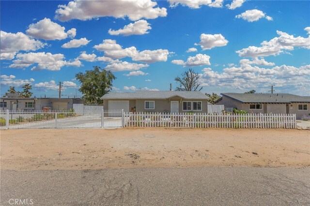 16116 Cajon, Hesperia, CA 92345 - ranch-style home featuring an attached garage, a fenced front yard, and driveway
