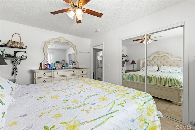 16116 Cajon, Hesperia, CA 92345 - tiled bedroom featuring a textured ceiling, a ceiling fan, and a closet