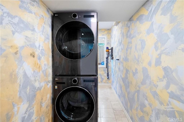 17211 Orozco St, Granada Hills, CA 91344 - laundry area featuring stacked washer / dryer, wallpapered walls, and tile patterned flooring
