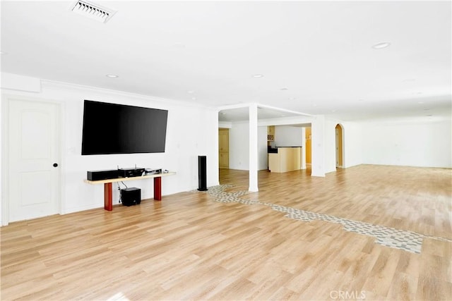17211 Orozco St, Granada Hills, CA 91344 - unfurnished living room featuring light wood-type flooring, arched walkways, recessed lighting, and crown molding