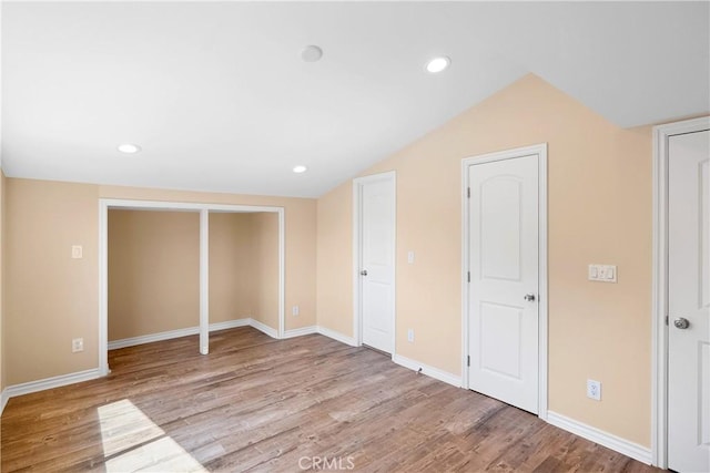 17211 Orozco St, Granada Hills, CA 91344 - unfurnished bedroom featuring wood finished floors, vaulted ceiling, and recessed lighting