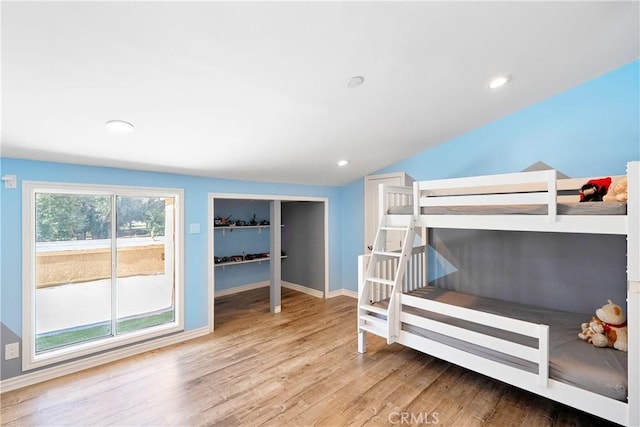 17211 Orozco St, Granada Hills, CA 91344 - bedroom featuring wood finished floors, vaulted ceiling, and recessed lighting