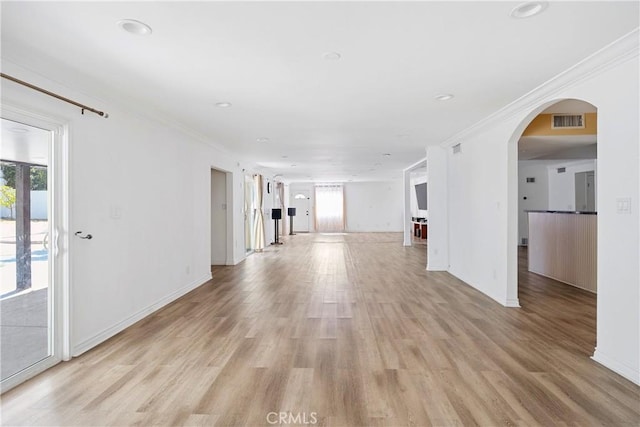 17211 Orozco St, Granada Hills, CA 91344 - unfurnished living room with ornamental molding, light wood-style flooring, arched walkways, and recessed lighting