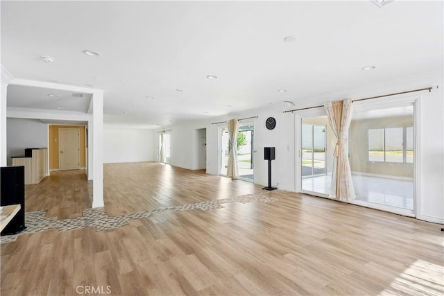 17211 Orozco St, Granada Hills, CA 91344 - unfurnished living room with light wood finished floors, recessed lighting, and crown molding