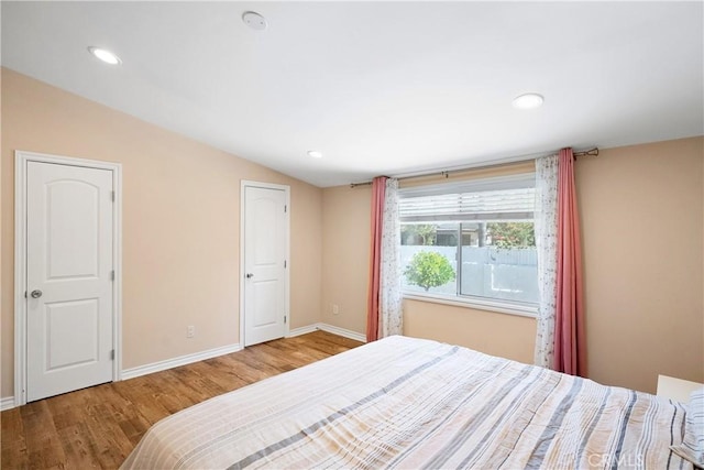 17211 Orozco St, Granada Hills, CA 91344 - bedroom with wood finished floors, lofted ceiling, and recessed lighting