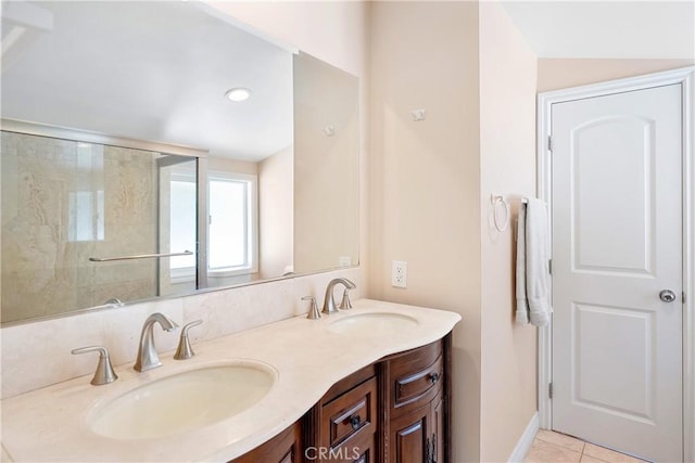 17211 Orozco St, Granada Hills, CA 91344 - bathroom with double vanity, tile patterned flooring, a shower, and recessed lighting
