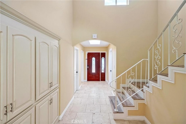 17211 Orozco St, Granada Hills, CA 91344 - foyer with arched walkways, a high ceiling, and stairs