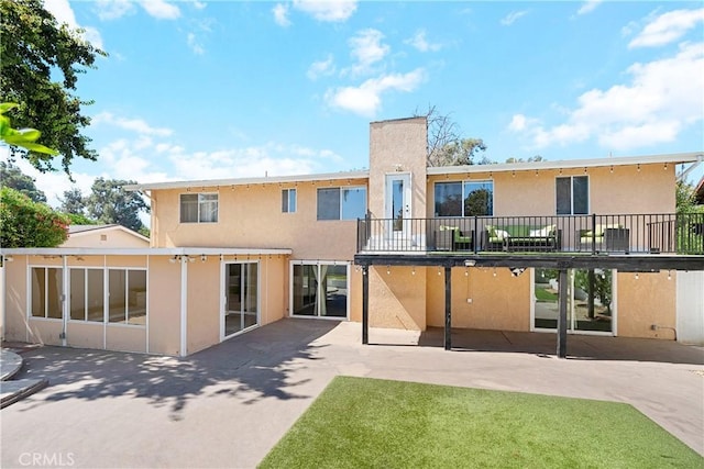 17211 Orozco St, Granada Hills, CA 91344 - back of house featuring stucco siding and a patio