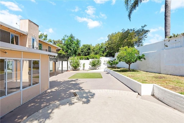 17211 Orozco St, Granada Hills, CA 91344 - fenced backyard featuring a patio area