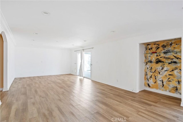 17211 Orozco St, Granada Hills, CA 91344 - empty room featuring arched walkways, light wood-style floors, crown molding, and recessed lighting
