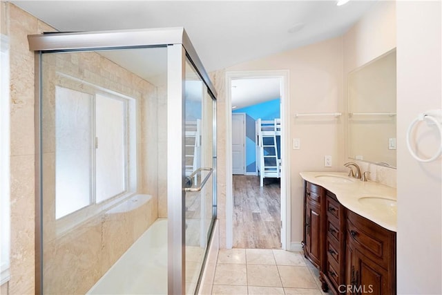 17211 Orozco St, Granada Hills, CA 91344 - full bath with double vanity, a shower with door, lofted ceiling, and tile patterned flooring