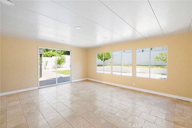 17211 Orozco St, Granada Hills, CA 91344 - empty room with baseboards and light tile patterned flooring