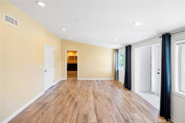 17211 Orozco St, Granada Hills, CA 91344 - empty room featuring light wood-type flooring, recessed lighting, and lofted ceiling