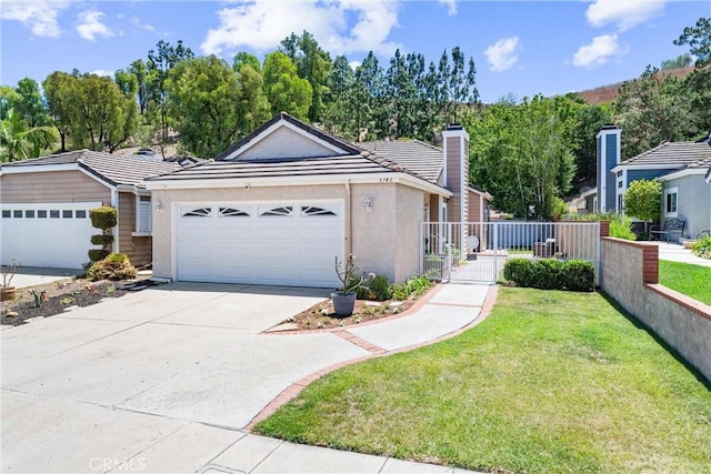 5742 E Hudson Bay Dr, Anaheim, CA 92807 - view of front of property featuring stucco siding, an attached garage, driveway, a chimney, and a tiled roof