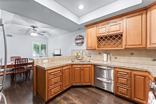5742 E Hudson Bay Dr, Anaheim, CA 92807 - kitchen featuring stainless steel dishwasher, a peninsula, ceiling fan, and dark wood-type flooring
