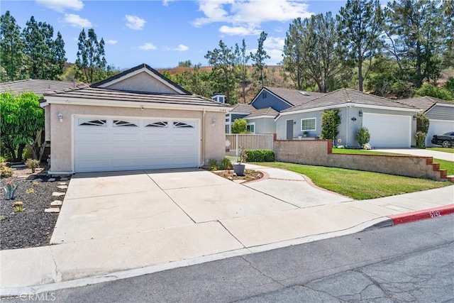 5742 E Hudson Bay Dr, Anaheim, CA 92807 - ranch-style home with stucco siding, concrete driveway, an attached garage, and a tiled roof