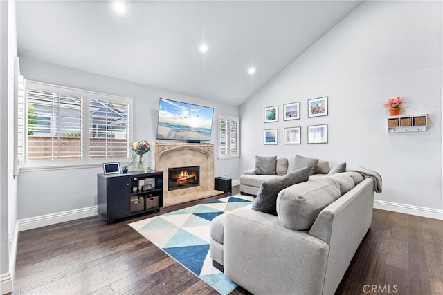 5742 E Hudson Bay Dr, Anaheim, CA 92807 - living area with healthy amount of natural light, a high end fireplace, dark wood-style floors, recessed lighting, and high vaulted ceiling