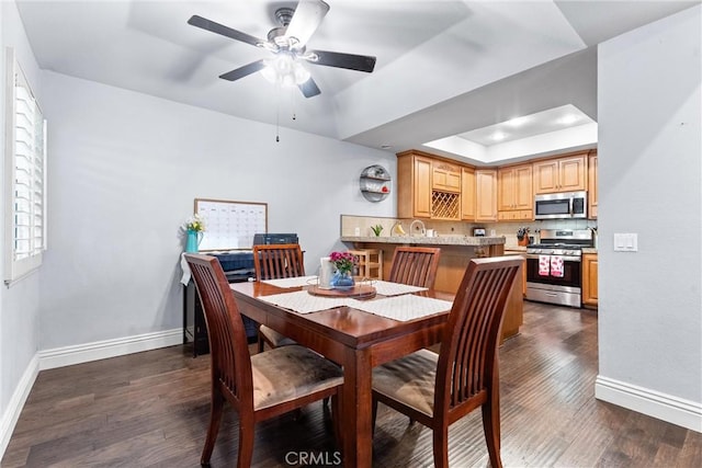 5742 E Hudson Bay Dr, Anaheim, CA 92807 - dining area with a raised ceiling, dark wood-type flooring, and a ceiling fan