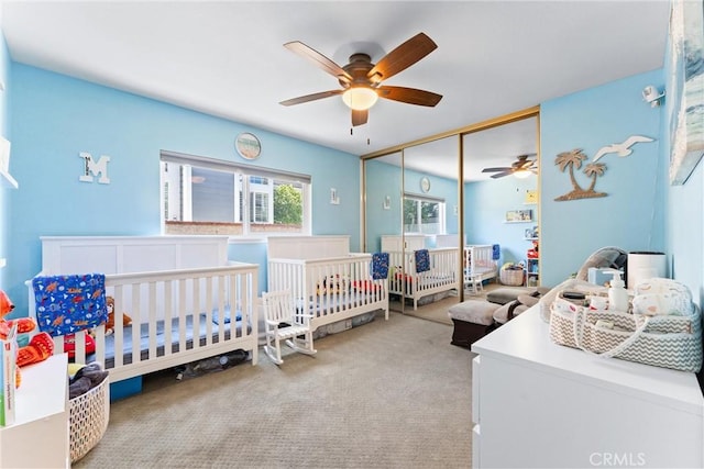 5742 E Hudson Bay Dr, Anaheim, CA 92807 - bedroom with carpet flooring, a closet, ceiling fan, and a crib