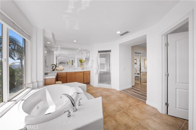 23735 Canyon Vista Ct, Diamond Bar, CA 91765 - bathroom featuring vanity, a shower stall, a jetted tub, tile patterned floors, and recessed lighting