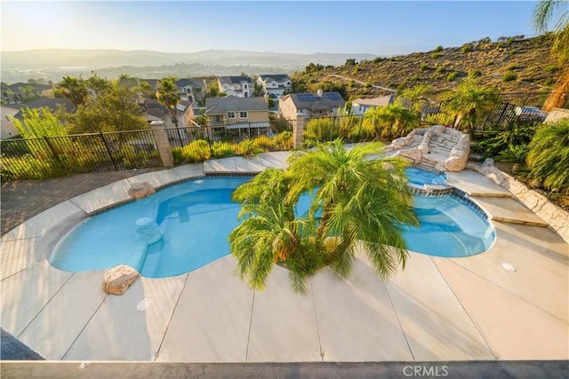 23735 Canyon Vista Ct, Diamond Bar, CA 91765 - view of swimming pool with a mountain view, a residential view, a pool with connected hot tub, and a patio area