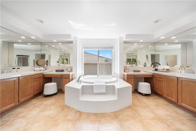 23735 Canyon Vista Ct, Diamond Bar, CA 91765 - bathroom with a bath, two vanities, tile patterned floors, and recessed lighting