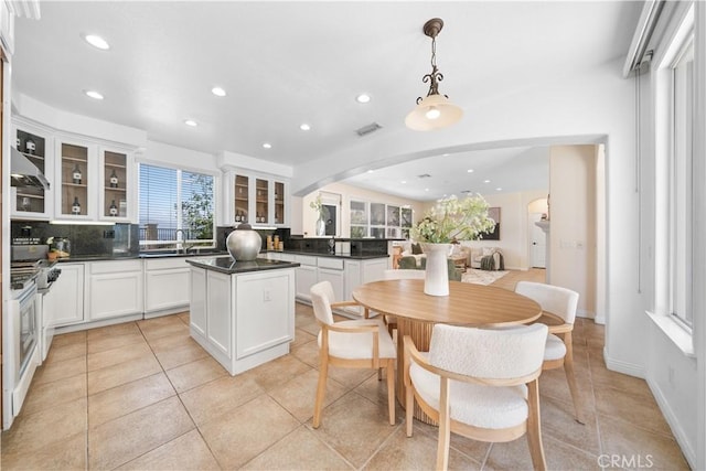 23735 Canyon Vista Ct, Diamond Bar, CA 91765 - kitchen with recessed lighting, dark countertops, backsplash, a center island, and arched walkways
