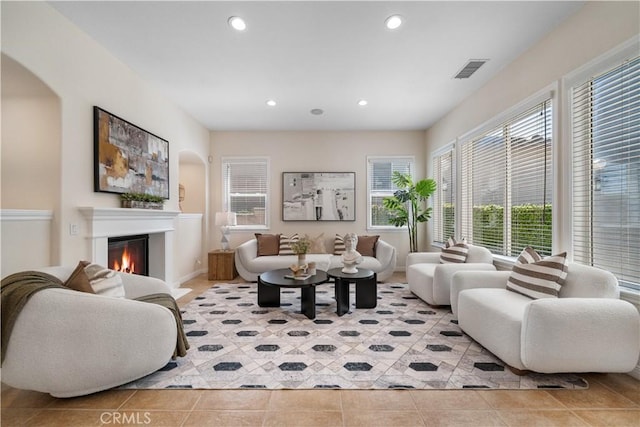 23735 Canyon Vista Ct, Diamond Bar, CA 91765 - living area with recessed lighting, a glass covered fireplace, and light tile patterned floors