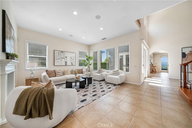 23735 Canyon Vista Ct, Diamond Bar, CA 91765 - living room featuring arched walkways, plenty of natural light, light tile patterned floors, and recessed lighting