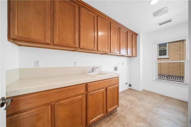 23735 Canyon Vista Ct, Diamond Bar, CA 91765 - laundry room featuring washer hookup, cabinet space, electric dryer hookup, and light tile patterned flooring