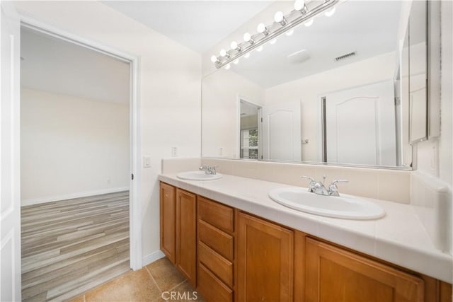 23735 Canyon Vista Ct, Diamond Bar, CA 91765 - full bath featuring double vanity and wood finished floors