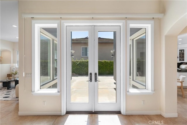 23735 Canyon Vista Ct, Diamond Bar, CA 91765 - entryway featuring french doors, arched walkways, healthy amount of natural light, and light tile patterned floors