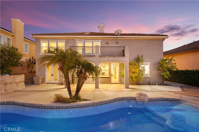 23735 Canyon Vista Ct, Diamond Bar, CA 91765 - rear view of property featuring a balcony, a patio, stucco siding, and an outdoor pool